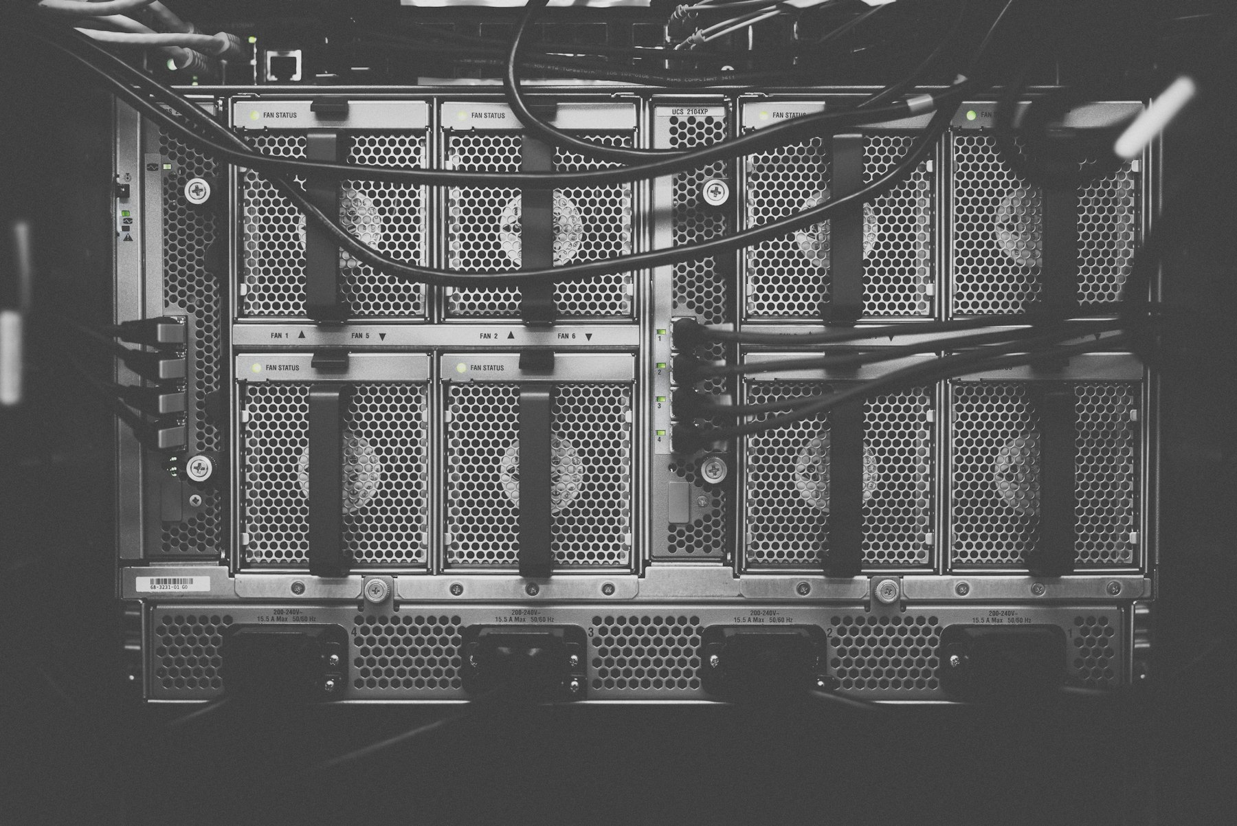 A server chassis with cabled fan bays, in black and white